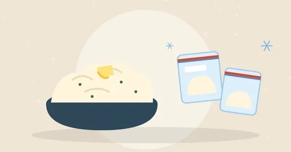 Bowl of creamy mashed potatoes with melting butter next to freezer bags of portioned mashed potatoes