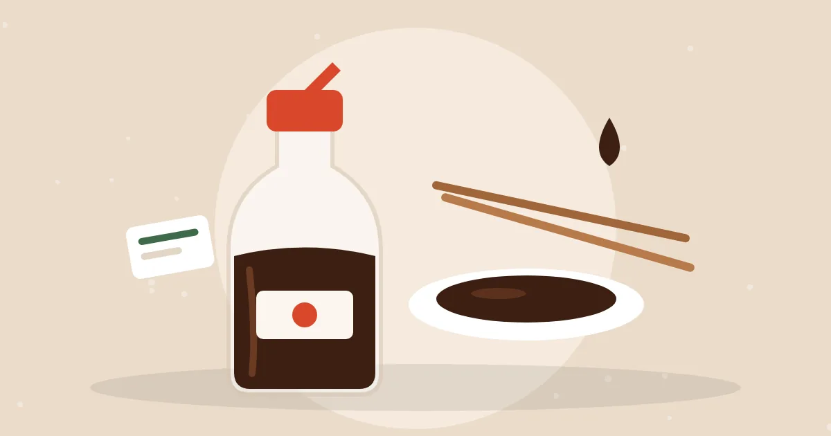 Soy sauce dispenser bottle with a red cap beside a small dish of soy sauce and chopsticks